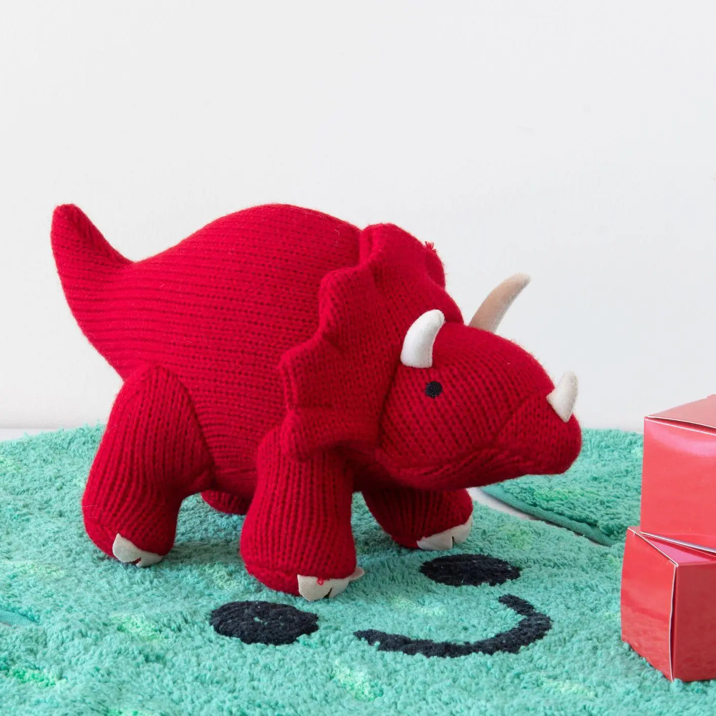 Peluche grande dinosauro triceratopo rosso lavorato a maglia